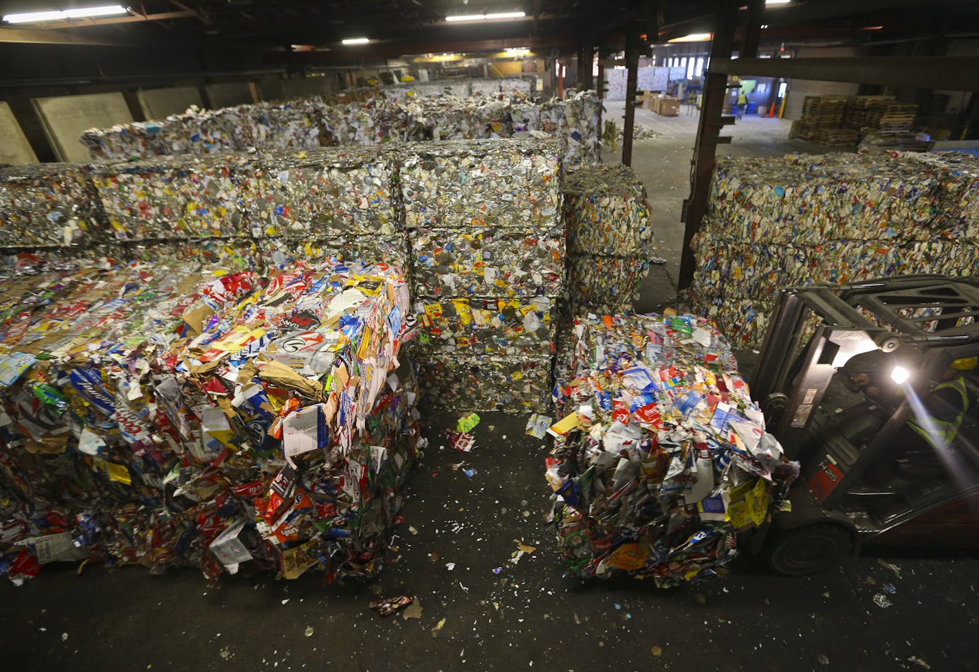 Equipment operator Marcella Ramirez moved a load of cardboard at Eureka Recycle on Friday, November 15, 2013 in Minneapolis, Minn. Eureka Recycles sorts 1 different recyclable materials.] RENEE JONES SCHNEIDER &#x2022; reneejones@startribune.com