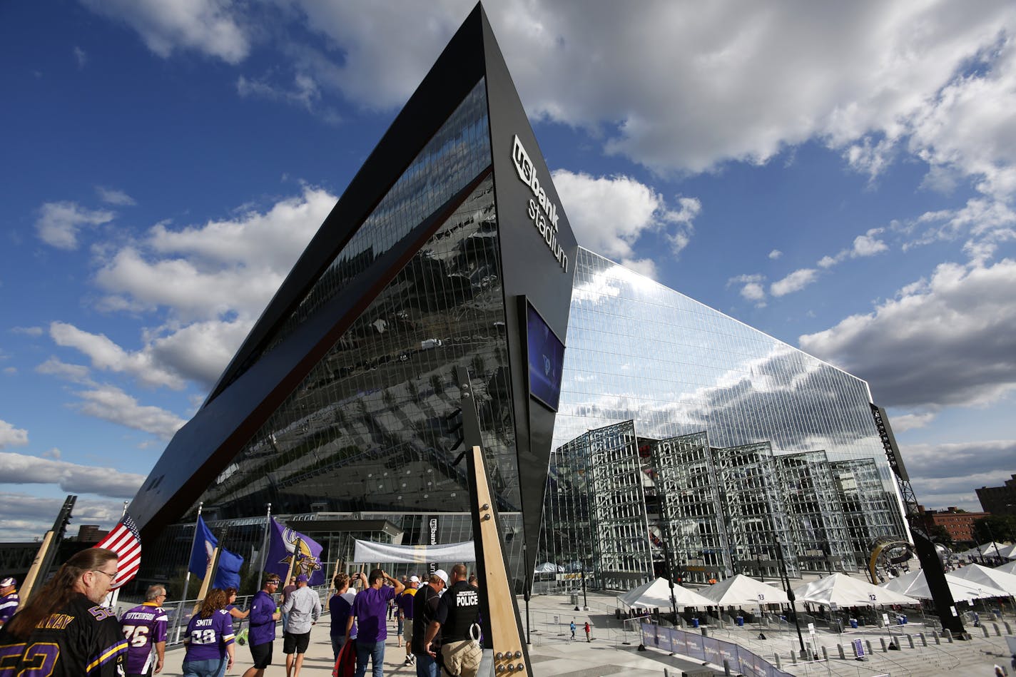 Fans arrive at U.S. Bank Stadium before an NFL preseason football game between the Minnesota Vikings and the Los Angeles Rams Thursday, Sept. 1, 2016, in Minneapolis. (AP Photo/Andy Clayton-King)