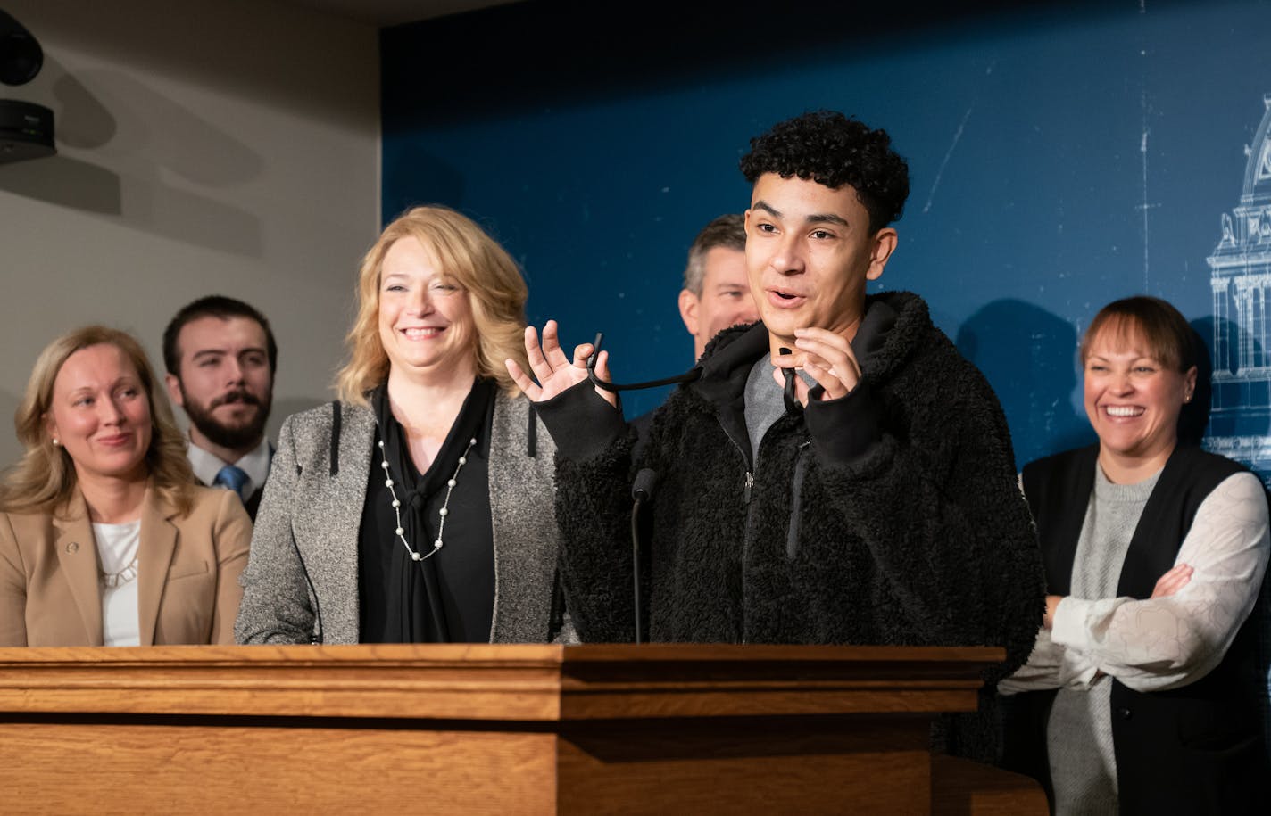 Yasiel Santiago-Castillo, a senior at Henry Sibley High School, held a vaping device disguised as a hoodie drawstring. Legislators laughed as he assured the group that he has never used one. On the left is Rep. Laurie Halverson, D-Eagan. Joined by students from Henry Sibley High School, Minnesota House DFL lawmakers introduced a new comprehensive plan to prevent youth tobacco use. ] GLEN STUBBE &#x2022; glen.stubbe@startribune.com Monday, October 28, 2019 Joined by students from Henry Sibley Hig