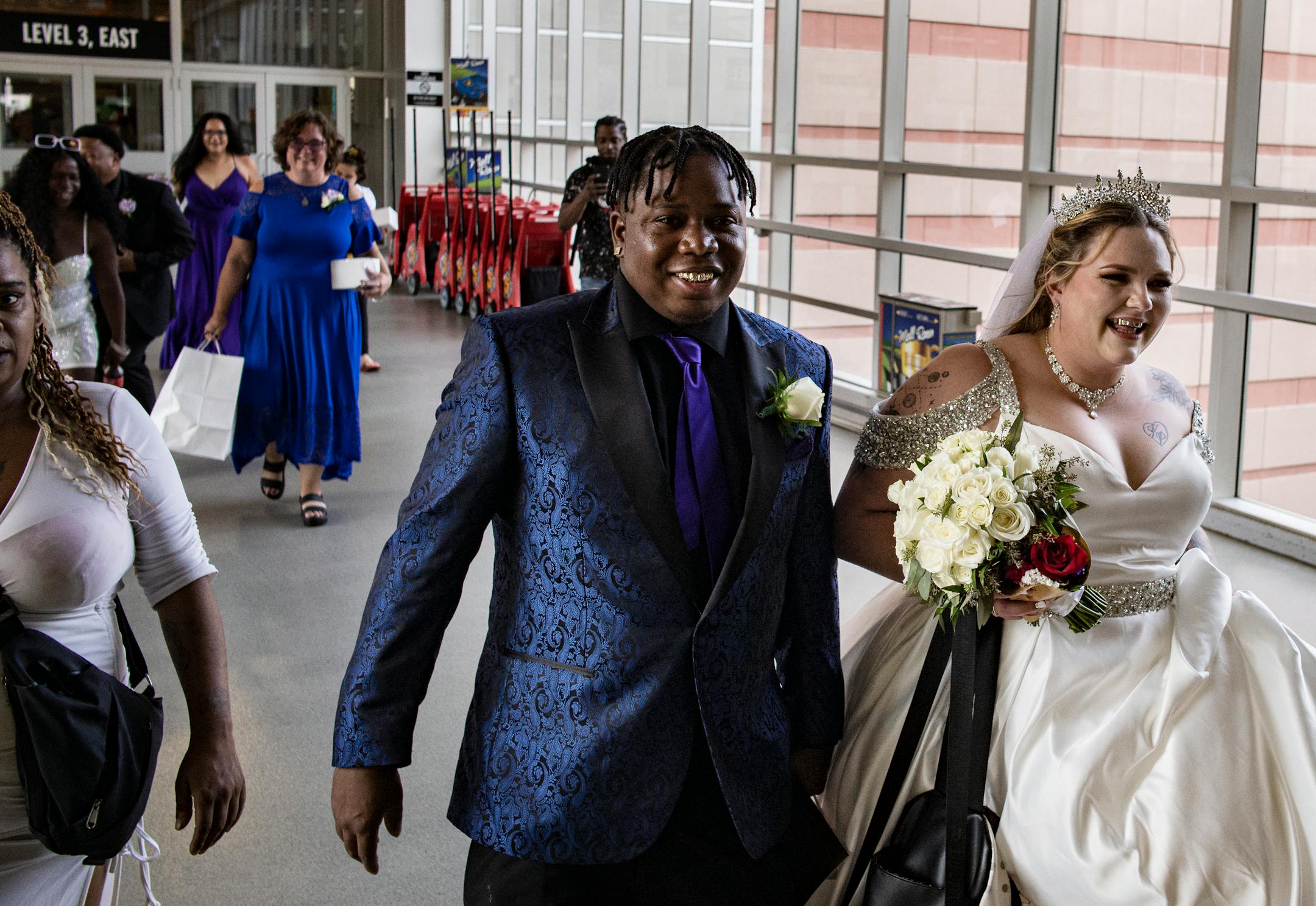 Andrea and Samuel Price walk out of the Chapel of Love and through the Mall of America as a newly married couple.