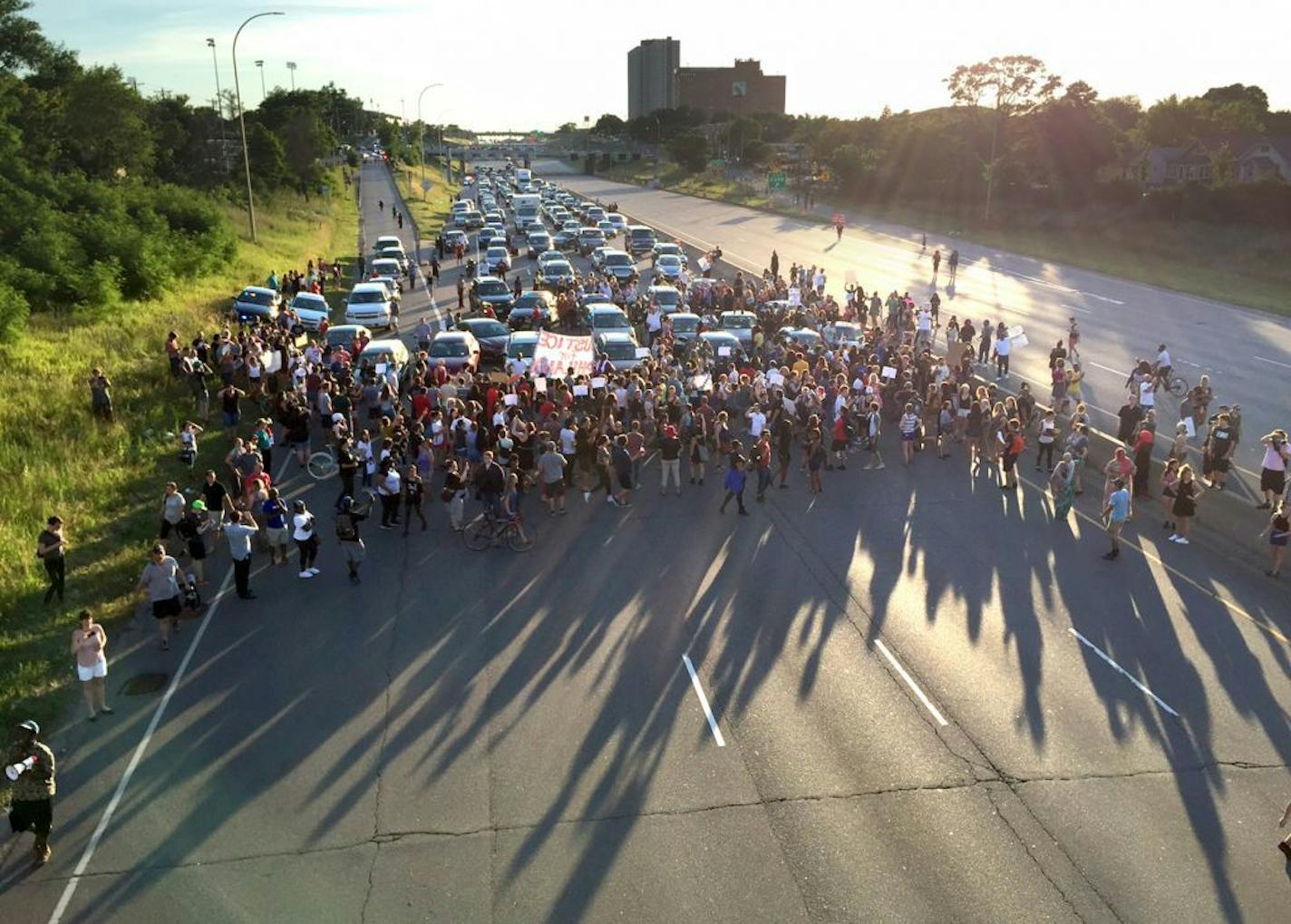 Marchers from the Black Lives Matter rally at the Minnesota Governor's Mansion, blocked off the interstate 94 eastbound lane near the Lexington Ave exit in St Paul Minnesota, July 9, 2016