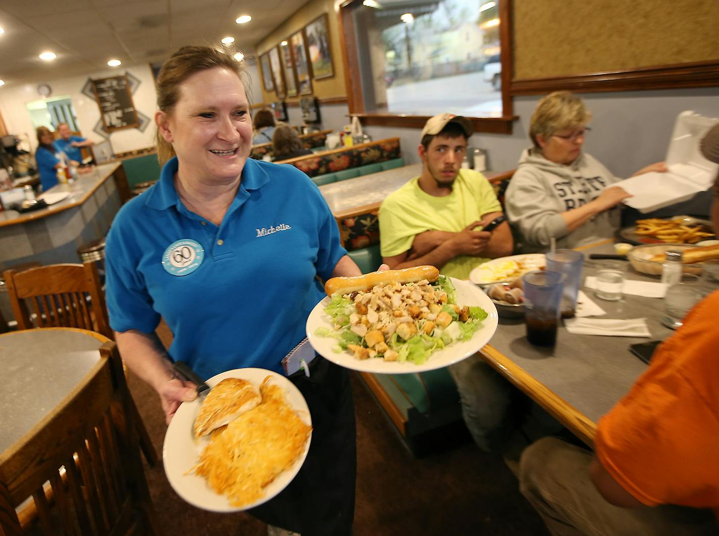 Michelle Rowback made her way to one of her tables during the dinner rush at Lange's Cafe, Tuesday, May 10, 2016 in Pipestone, MN. ] (ELIZABETH FLORES/STAR TRIBUNE) ELIZABETH FLORES &#x2022; eflores@startribune.com