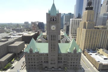 The Minneapolis City Hall with clock tower and Quest Building. Skyline