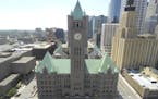 The Minneapolis City Hall with clock tower and Quest Building. Skyline