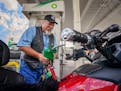 Bob Lodin filled his Honda Gold Wing motorcycle with $2.39 gas at the BP gas station ay 46th Street at Lyndale in South Minneapolis. ] GLEN STUBBE * g