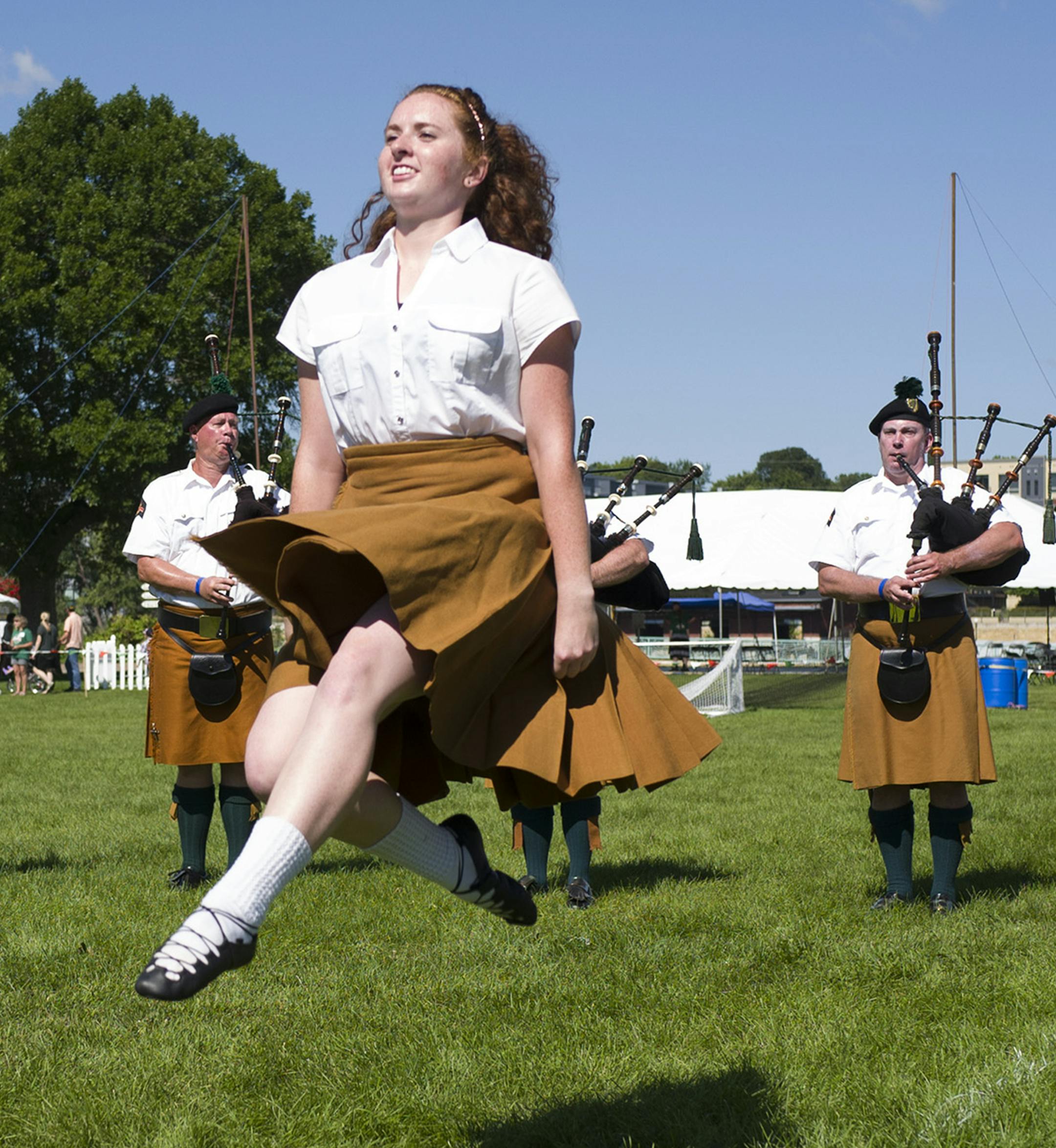 Hannah Schwarze performed a Irish folk dance with as members of the Brian Boru Irish Pipe band performed Sunday at Harriet Island August 14, 2016 in St. Paul, MN.] The Irish Fair of Minnesota was held atHarriet Island. Jerry Holt / jerry.Holt@Startribune.com ORG XMIT: MIN1608141556120861 ORG XMIT: MIN1608141605500868