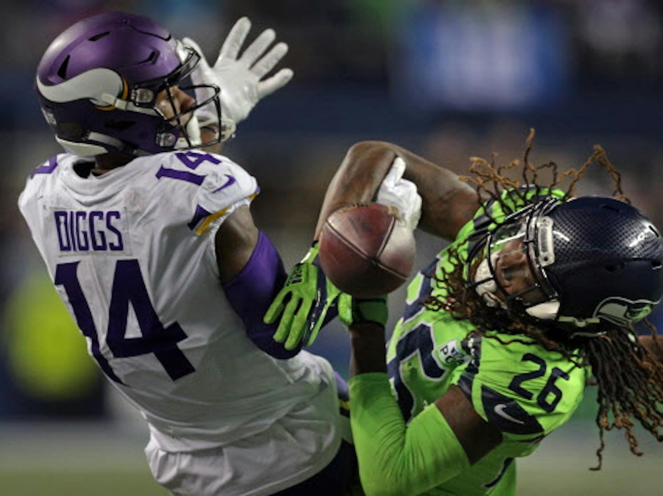 A pass intended for Stefon Diggs in the 4th quarter falls incomplete withg the help of Seattle's Shaquill Griffin.   ] Minnesota Vikings vs Seattle Seahawks - CenturyLink Field.