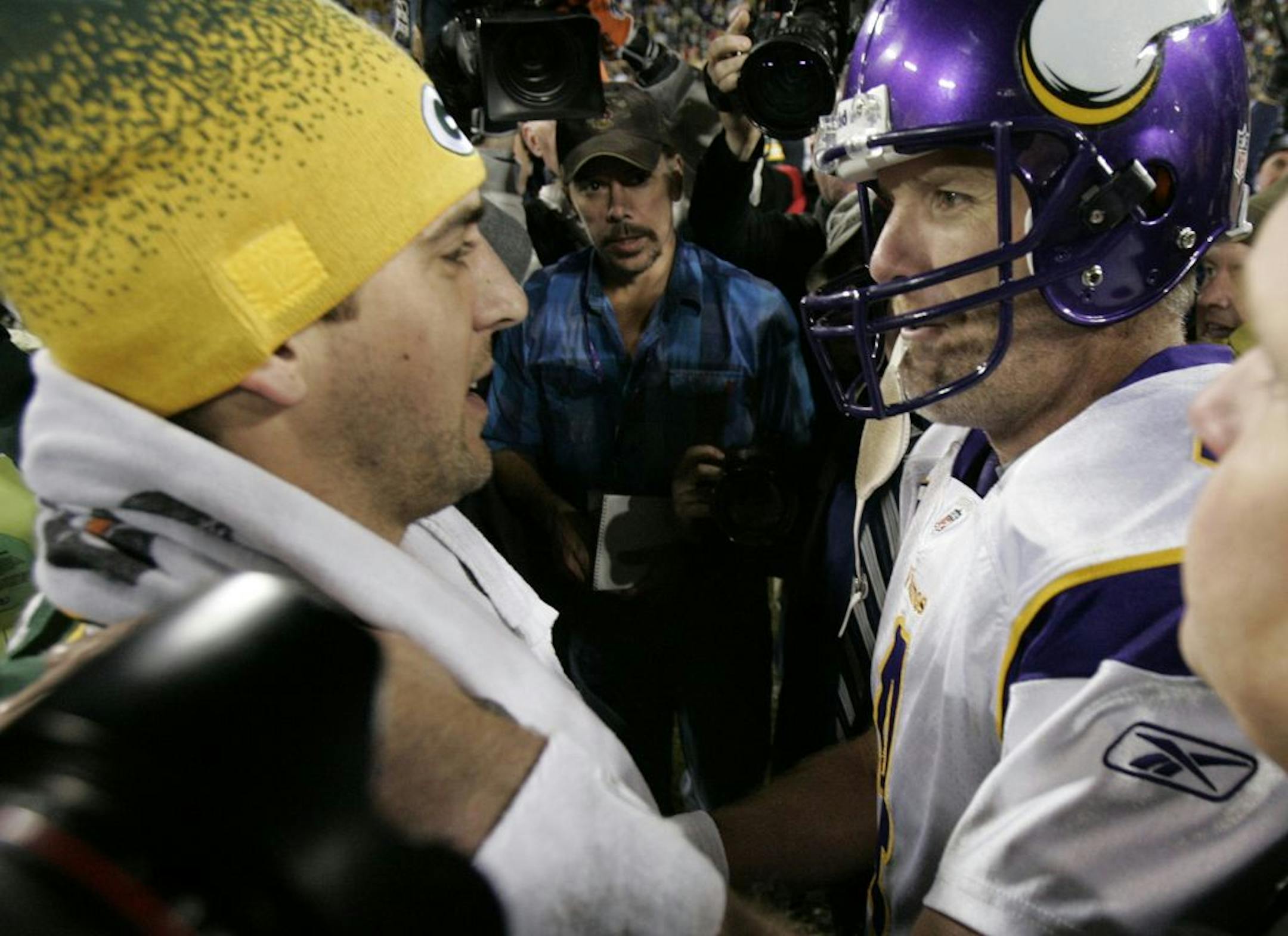 Aaron Rodgers greets Brett Favre after a game at Lambeau Field in 2009. The Vikings defeated the Packers, 38-26.