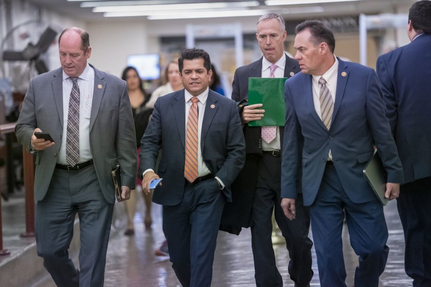 Members of the House walk to the chamber for a vote on an anti-hate resolution, as Speaker of the House Nancy Pelosi said, "anti-Semitism, anti-Islamophobia, anti-white supremacy and all the forms that it takes," an action sparked by controversial remarks from freshman Democrat Ilhan Omar, at the Capitol in Washington, Thursday, March 7, 2019.