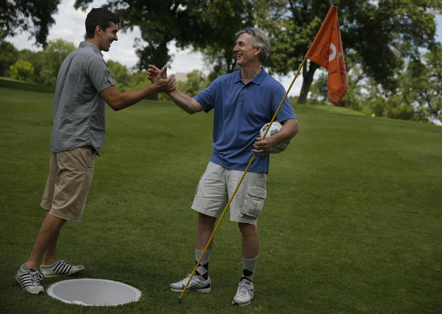 At the Hyland Golf Course in Bloomington on July 16, 2014, footgolf enthusiasts Peter Anderson and his father Mark ended the day on a conciliatory note in spite of the father/son jock rivalry. ]Richard Tsong-Taatarii/rtsong-taatarii@startribune.com