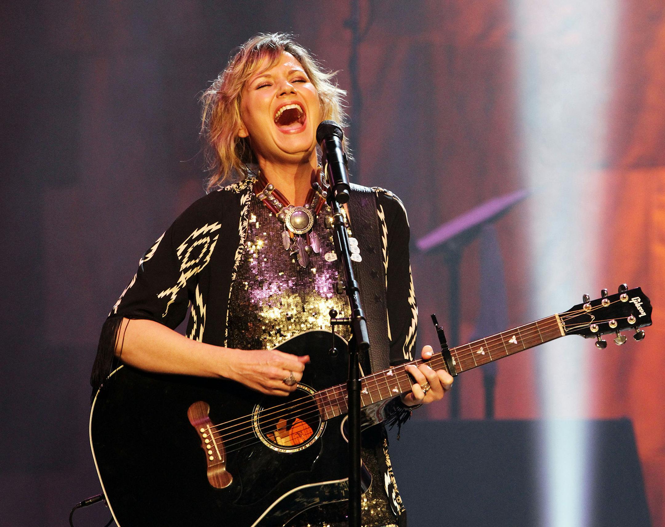 Jennifer Nettles of Sugarland performing at The Fabulous Fox Theatre on Saturday, Feb. 22, 2014, in Atlanta. (Photo by Robb D. Cohen/Invision/AP) ORG XMIT: INVW
