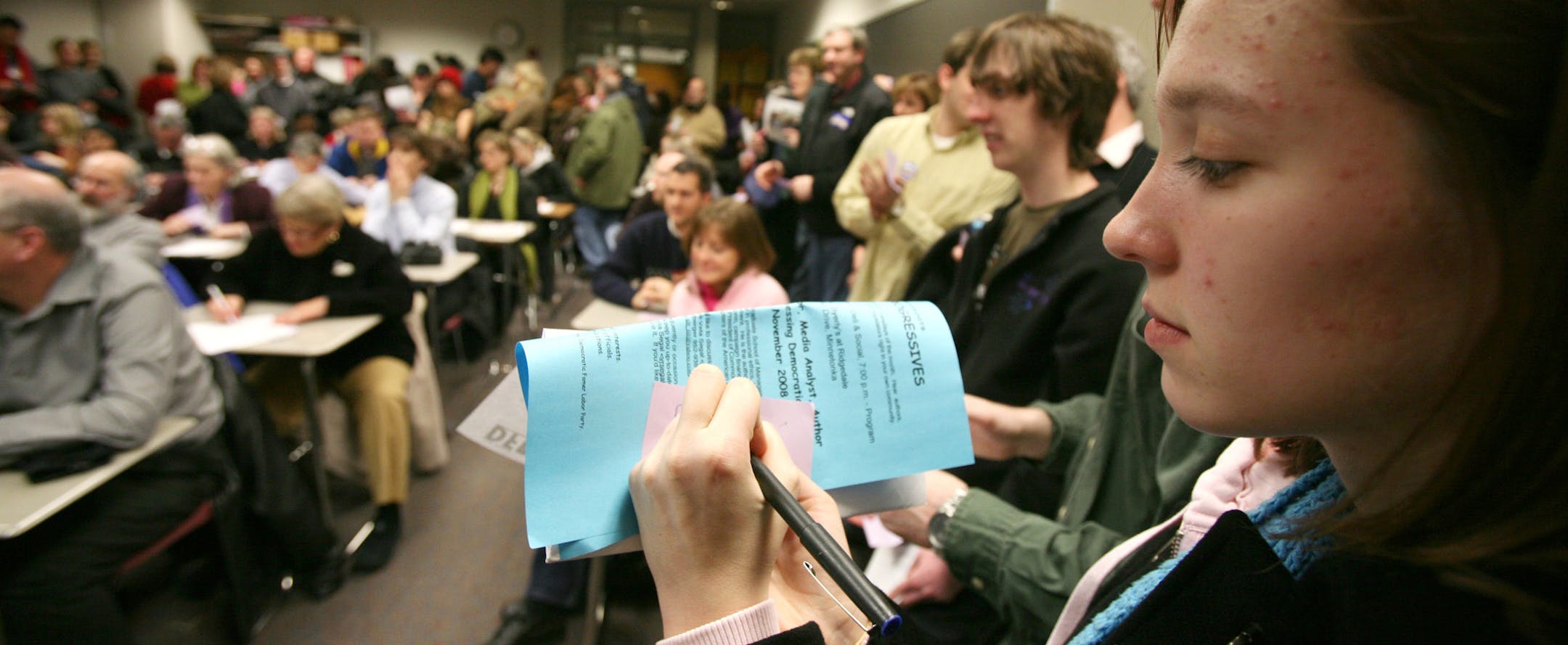 First-time caucus-goer Molly Kelly-Goss, 18, made her pick for president Tuesday night at a DFL precinct caucus in Eden Prairie. She was there with her brothers Michael, 18, and Patrick, 21.