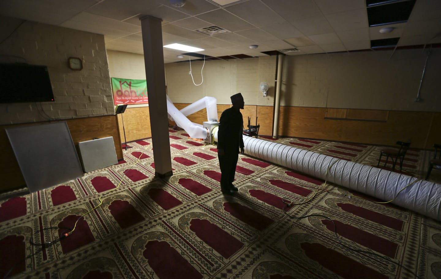 Imam Sharif Mohamed walked through the Dar Al-Hijrah mosque Thursday in Minneapolis. It is being cleaned and aired out after a fire next door Jan. 1.