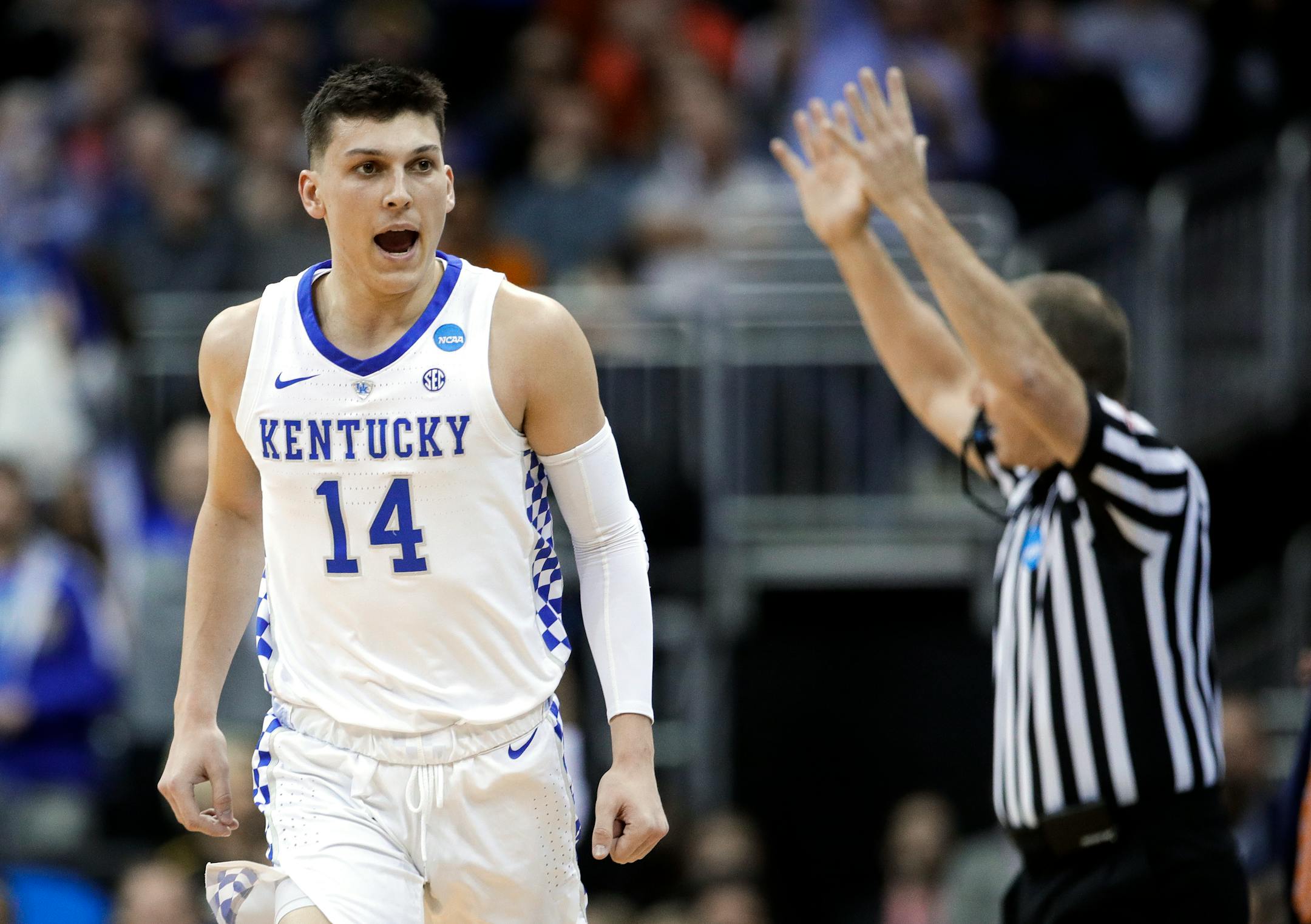 Kentucky's Tyler Herro celebrates after making a 3-point basket against Auburn during the first half of the Midwest Regional final game in the NCAA men's college basketball tournament Sunday, March 31, 2019, in Kansas City, Mo. (AP Photo/Charlie Riedel)
