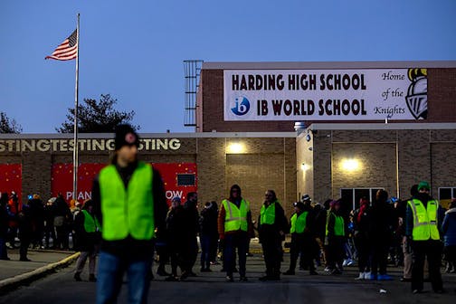 People gathered Monday for a candlelight vigil at Harding High School in St. Paul 13, 2023, to remember student Devin Scott, 15, who was stabbed and killed by another student at the school last Friday. Classes are set to resume at Harding on Friday.