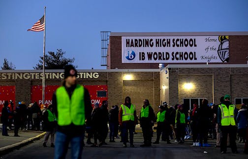 People gathered Monday for a candlelight vigil at Harding High School in St. Paul 13, 2023, to remember student Devin Scott, 15, who was stabbed and killed by another student at the school last Friday. Classes are set to resume at Harding on Friday.