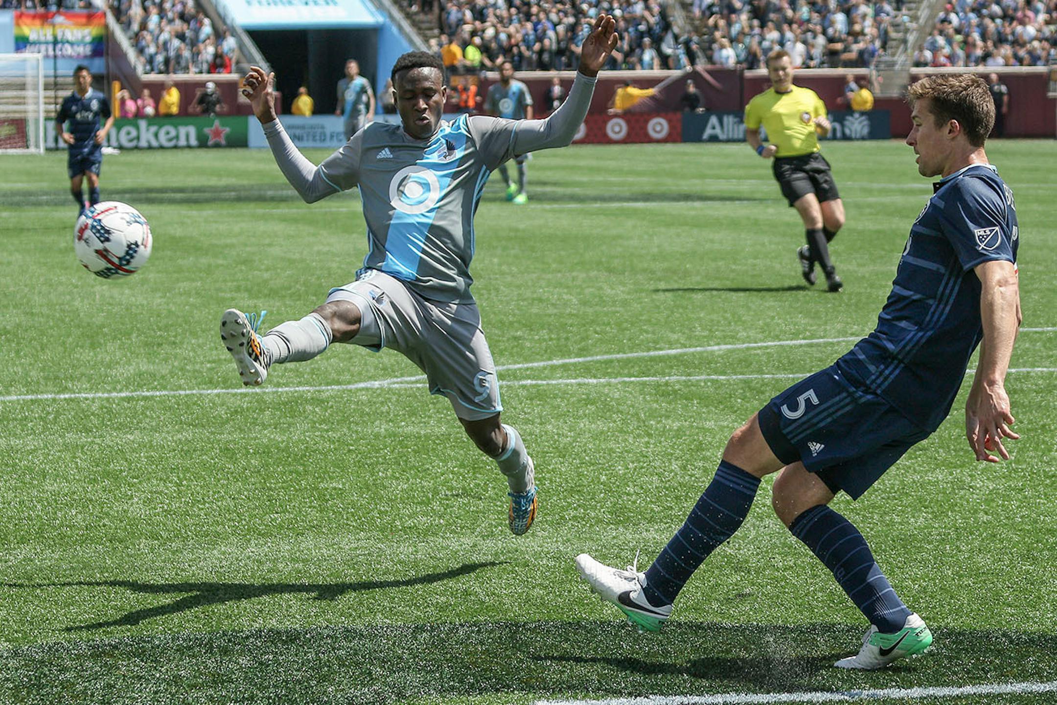 Minnesota United rookie forward Abu Danladi (9), shown here in a May 7 match against Sporting Kansas City, left Sunday's 2-1 loss to Los Angeles in the 41st minute, limping to the locker room with the help of trainers.