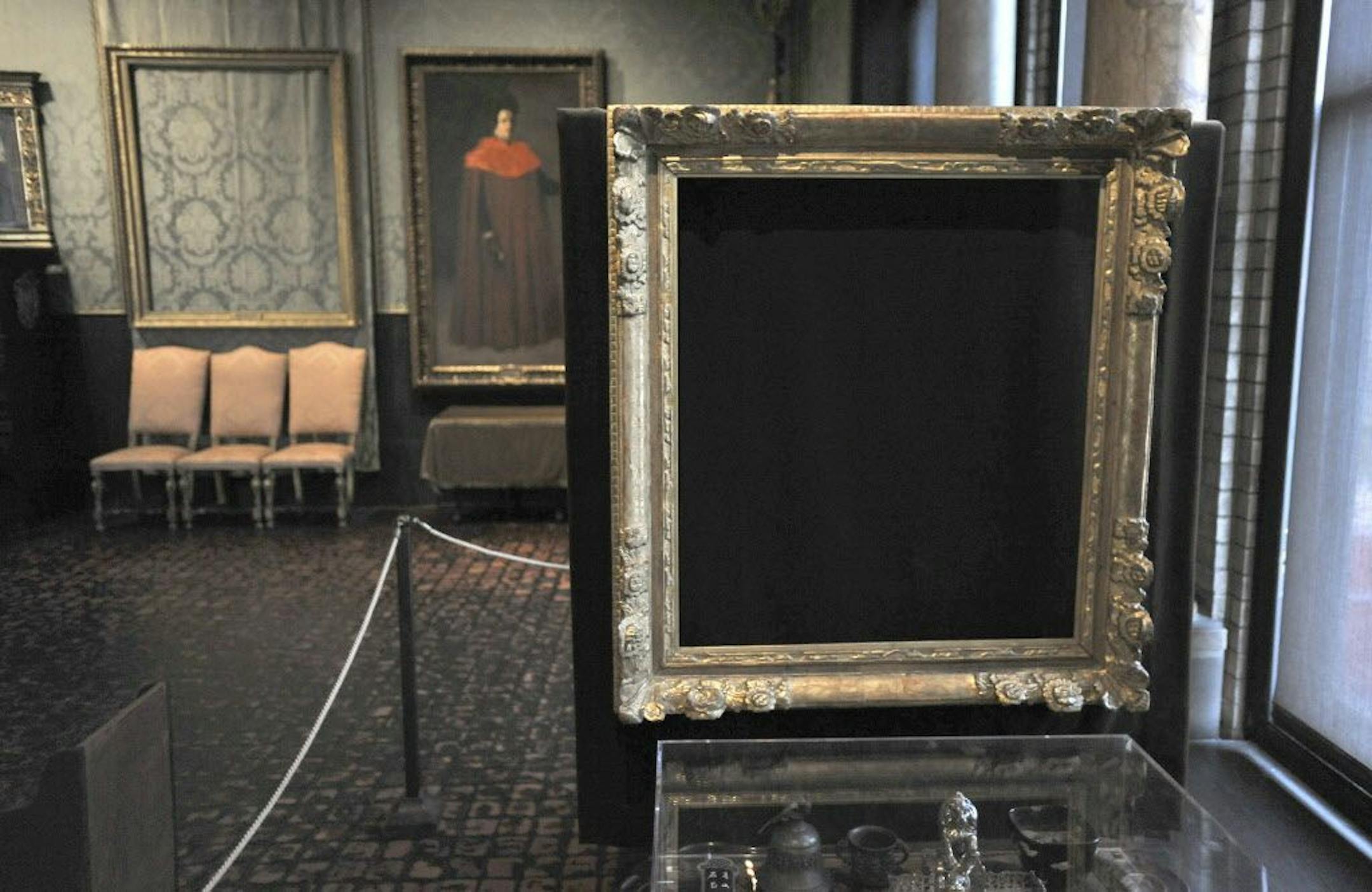 FILE - In this Thursday, March 11, 2010, file photo, empty frames remain on display at the Isabella Stewart Gardner Museum in Boston, marking the theft of major works of art.