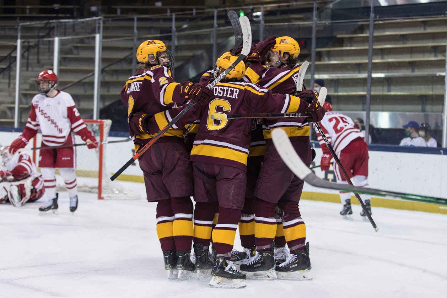 Minnesota players celebrate a goal against Wisconsin during the championship game of the Big Ten men's hockey tournament Tuesday, March 16, 2021, in South Bend, Ind. (John Mersits/South Bend Tribune via AP)