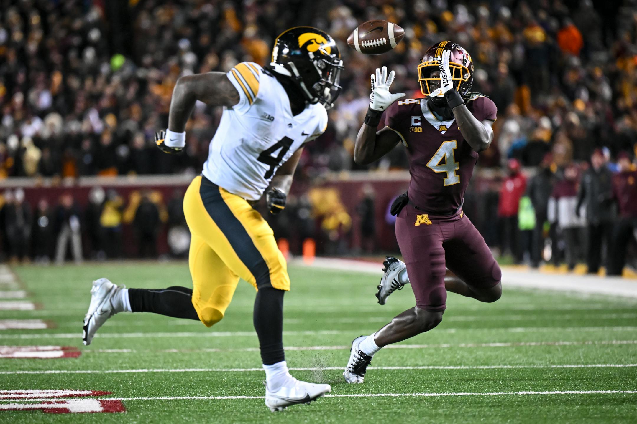 Minnesota Gophers defensive back Terell Smith (4) nearly intercepts a pass intended for Iowa Hawkeyes running back Leshon Williams (4), but drops the ball during the fourth quarter.