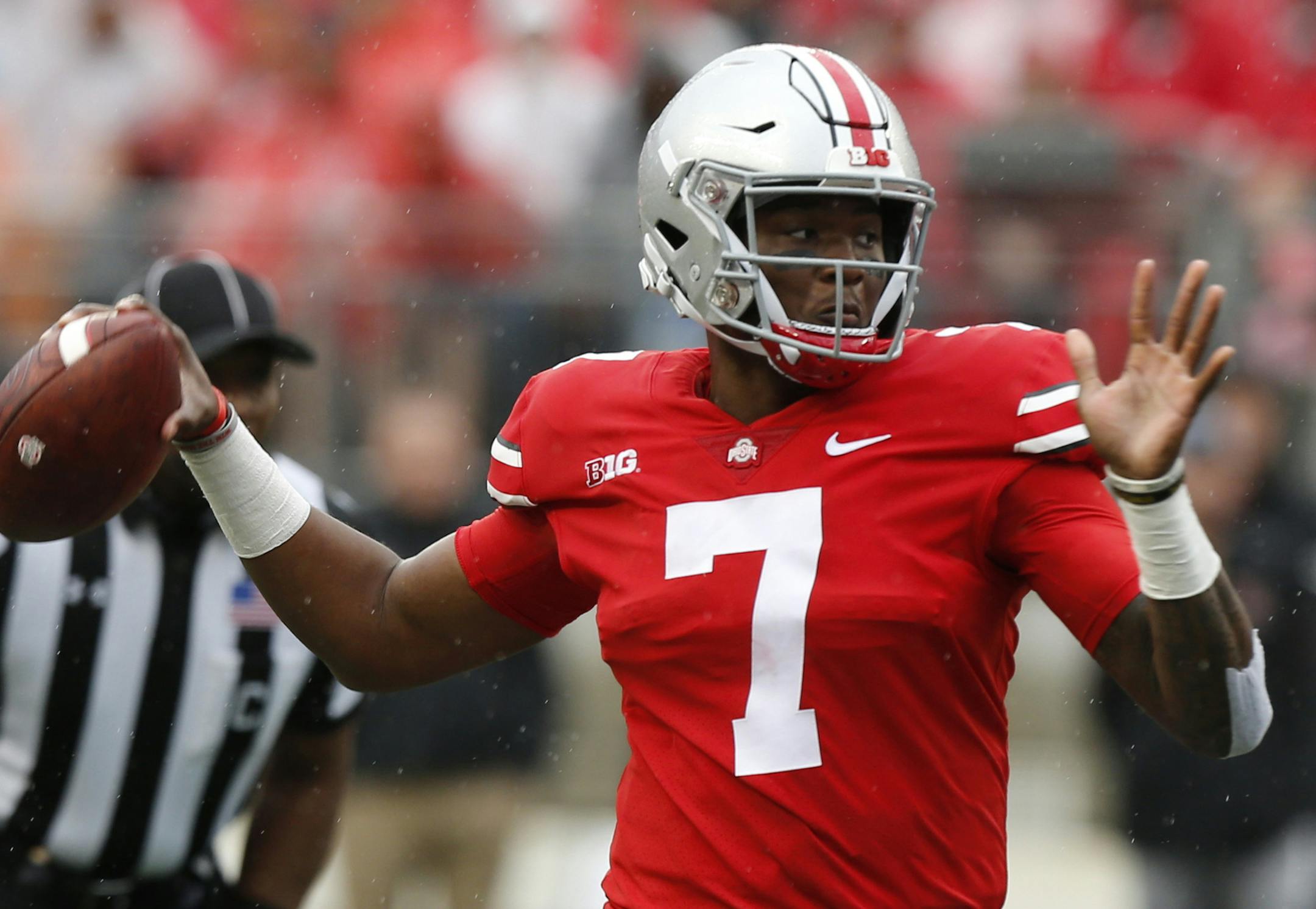 FILE - In this Sept. 8, 2018, file photo, Ohio State quarterback Dwayne Haskins looks for a receiver during the team's NCAA college football game against Rutgers in Columbus, Ohio. Saturday night&#x2019;s clash between No. 4 Ohio State and No. 9 Penn State for Big Ten East supremacy promises to be an offensively explosive affair. The programs boast the two top scoring offenses in the country through four games, with Penn State averaging 55.5 points and the Buckeyes right behind them at 54.5. The