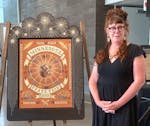 Artist Liz Schreiber with her 2023 Minnesota State Fair commemorative artwork.