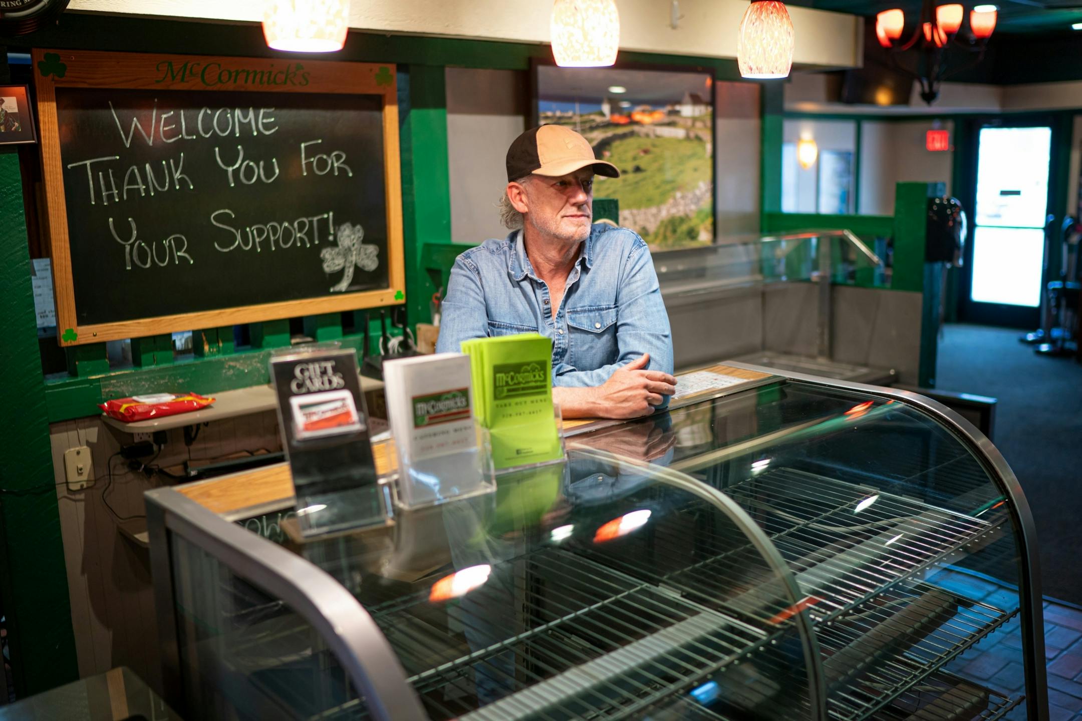 Joe McCormick, owner of McCormick's Family Restaurant, leaned on glass counter that had always been filled with pies and cinnamon rolls, is now empty. They initially tried to do a carryout business but couldn't make it work.