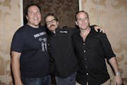 From left to right, actor and director Jon Favreau, actor Adam Beach, actor Sam Rockwell, and actor Clark Gregg at a press conference at Comic Con in 