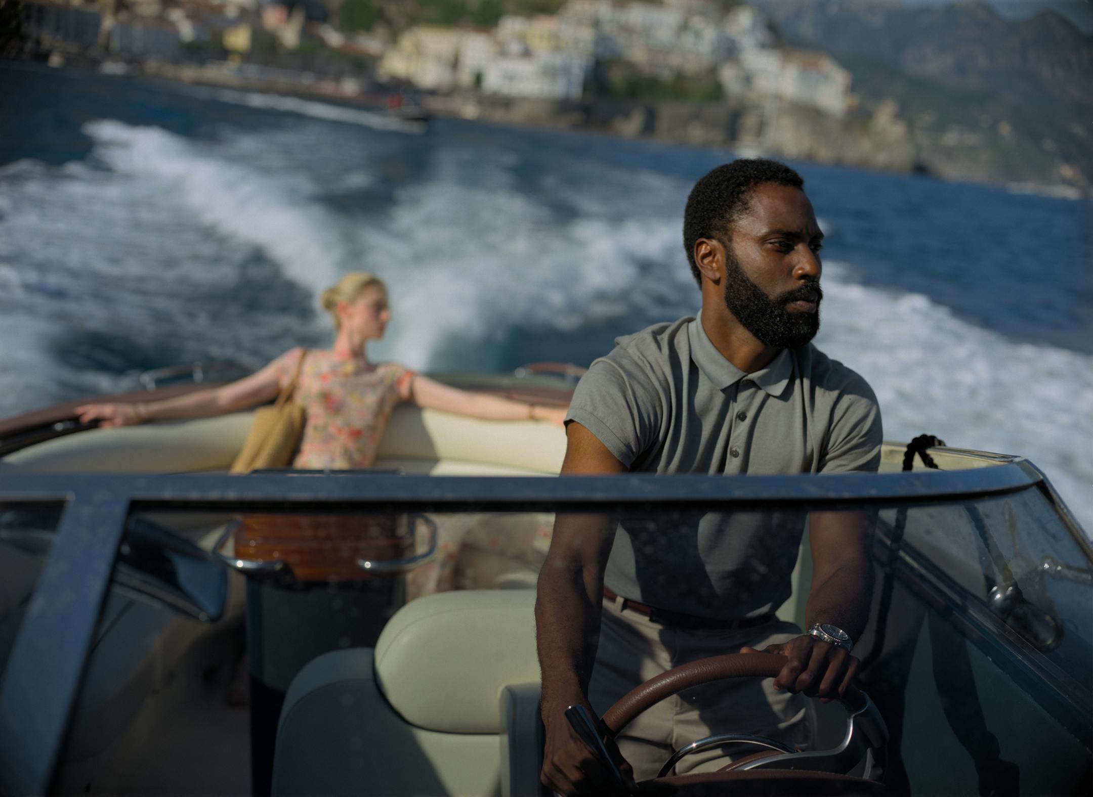 This image released by Warner Bros. Entertainment shows Elizabeth Debicki, left, and John David Washington in a scene from "Tenet." As "Tenet" enters its third week in North American cinemas with barely any new blockbusters on the horizon, U.S. exhibitors are put in a tricky spot. (Melinda Sue Gordon/Warner Bros. Entertainment via AP)