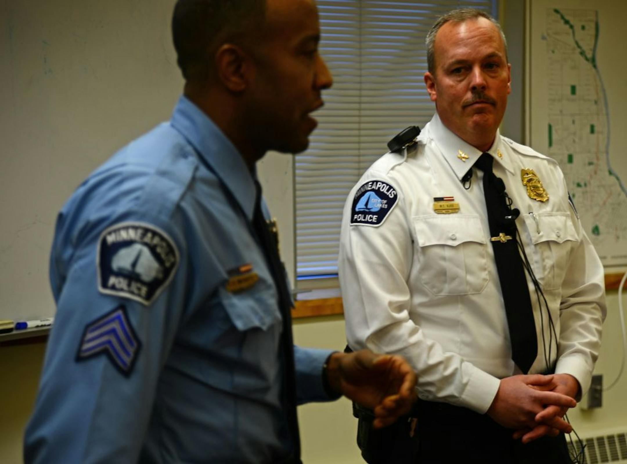 Sgt. Stephen McCarty and Inspector Mike Kjos gave a briefing at the 4th precinct about the homicide on Queen Ave. N.. A woman was found stabbed to death in a north Minneapolis home early Thursday, authorities said. The body was found about 3:40 a.m. at a house in the 2300 block of Queen Avenue N., according to Minneapolis police.