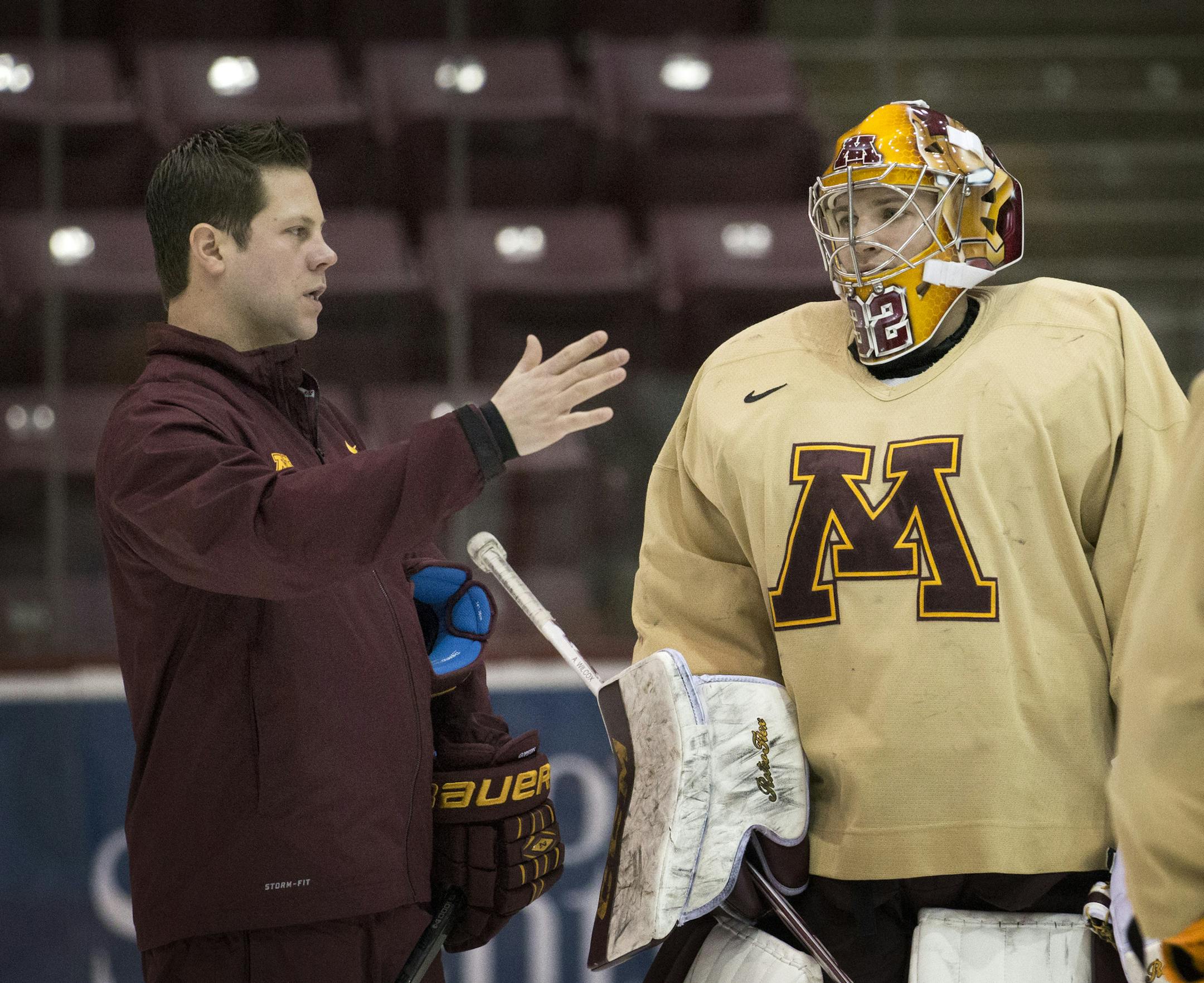 U of M goaltender Adam Wilcox with goalie coach Justin Johnson during goaltender practice on Wednesday ] BRIAN PETERSON &#x201a;&#xc4;&#xa2; brian.peterson@startribune.com Minneapolis, MN 12/19/14