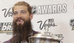 Brent Burns of the San Jose Sharks poses with the James Norris Memorial Trophy after winning the award during the NHL Awards, Wednesday, June 21, 2017
