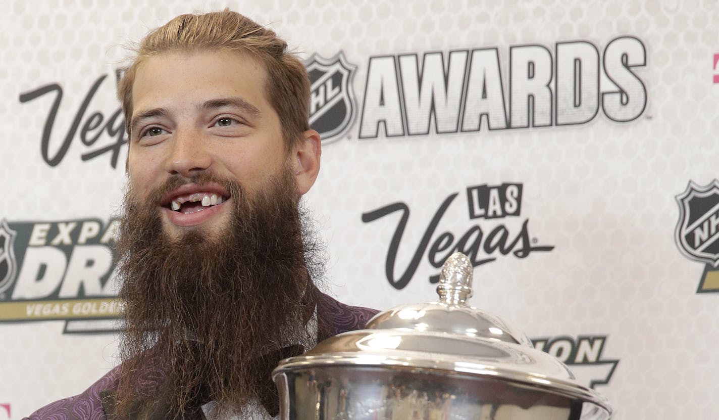 Brent Burns of the San Jose Sharks poses with the James Norris Memorial Trophy after winning the award during the NHL Awards, Wednesday, June 21, 2017, in Las Vegas. (AP Photo/John Locher)