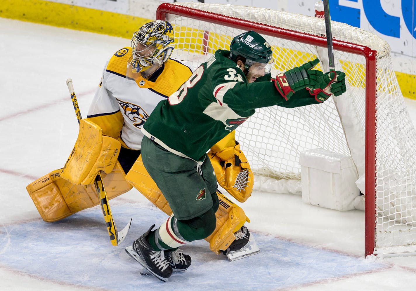 Ryan Hartman (38) of the Minnesota Wild celebrates after getting puck past Nashville Predators goalie Juuse Saros (74) for the game winning goal in the third period Sunday, February 19, 2022, at Xcel Energy Center in St. Paul, Minn. ] CARLOS GONZALEZ • carlos.gonzalez@startribune.com.