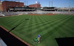 A member of the grounds crew striped the outfield at CHS Field in May