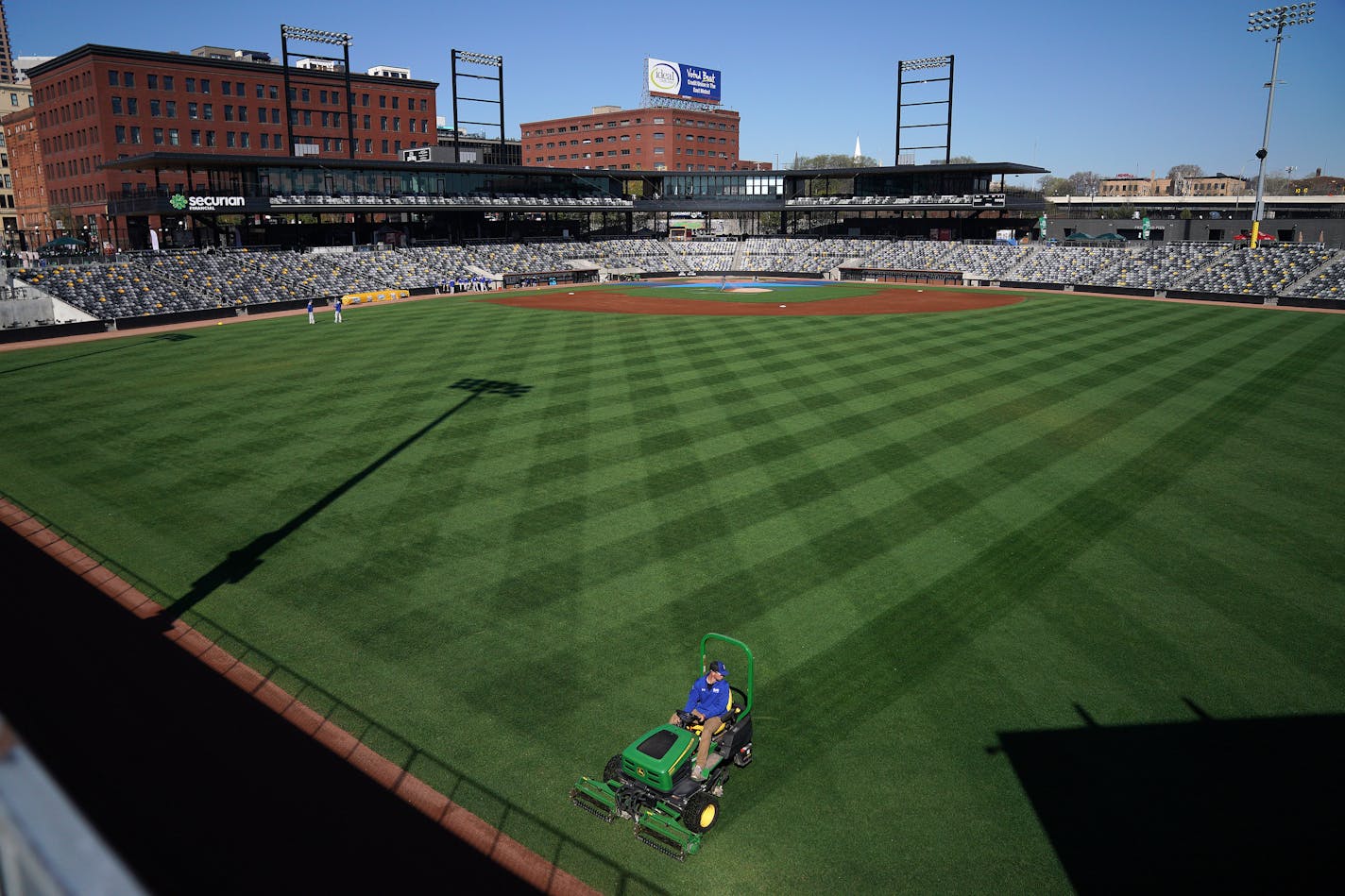 A member of the grounds crew striped the outfield at CHS Field in May