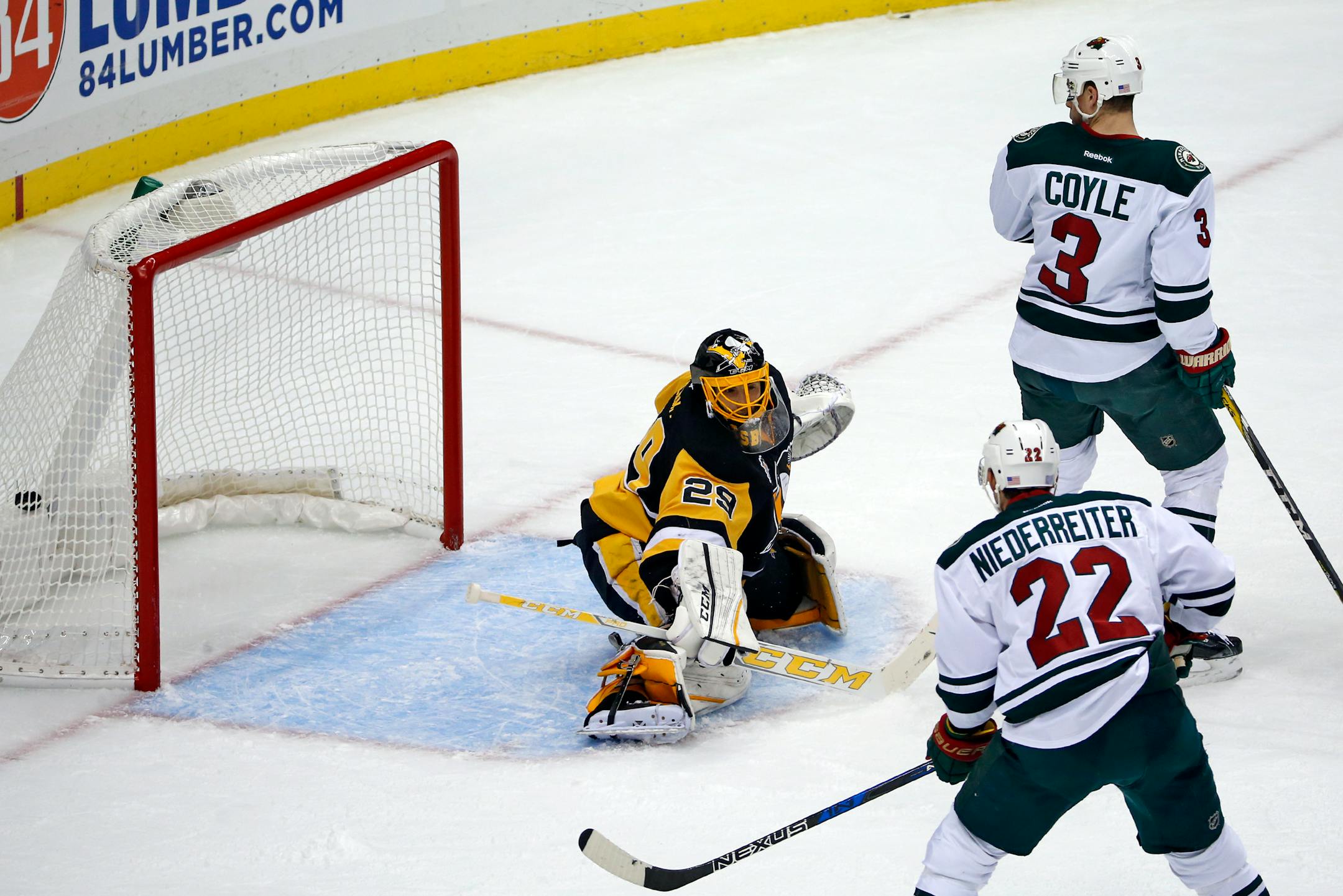 Minnesota Wild's Charlie Coyle (3) watches his deflection of a shot by Ryan Suter, past Pittsburgh Penguins goalie Marc-Andre Fleury (29) for a goal during the first period of an NHL hockey game in Pittsburgh, Thursday, Nov. 10, 2016. (AP Photo/Gene J. Puskar)