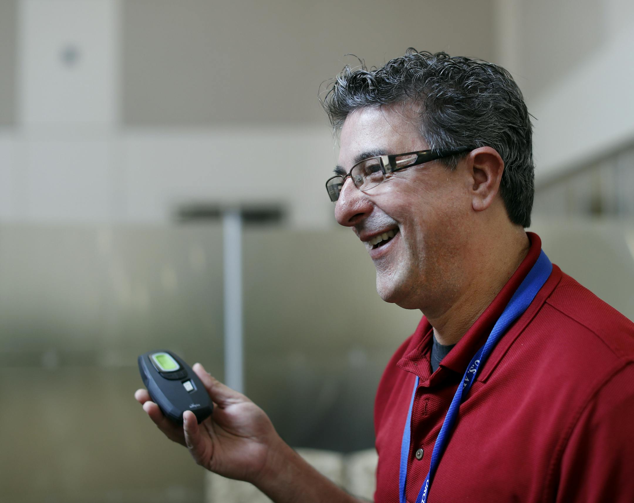 Daniel Tarro, shown holding the controller for the Inspire device, was the second patient implanted with it at the Minneapolis Veterans Medical Center.