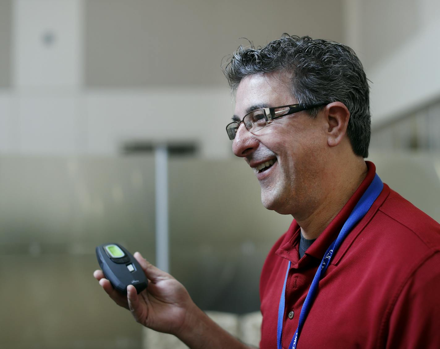 Daniel Tarro, shown holding the controller for the Inspire device, was the second patient implanted with it at the Minneapolis Veterans Medical Center.