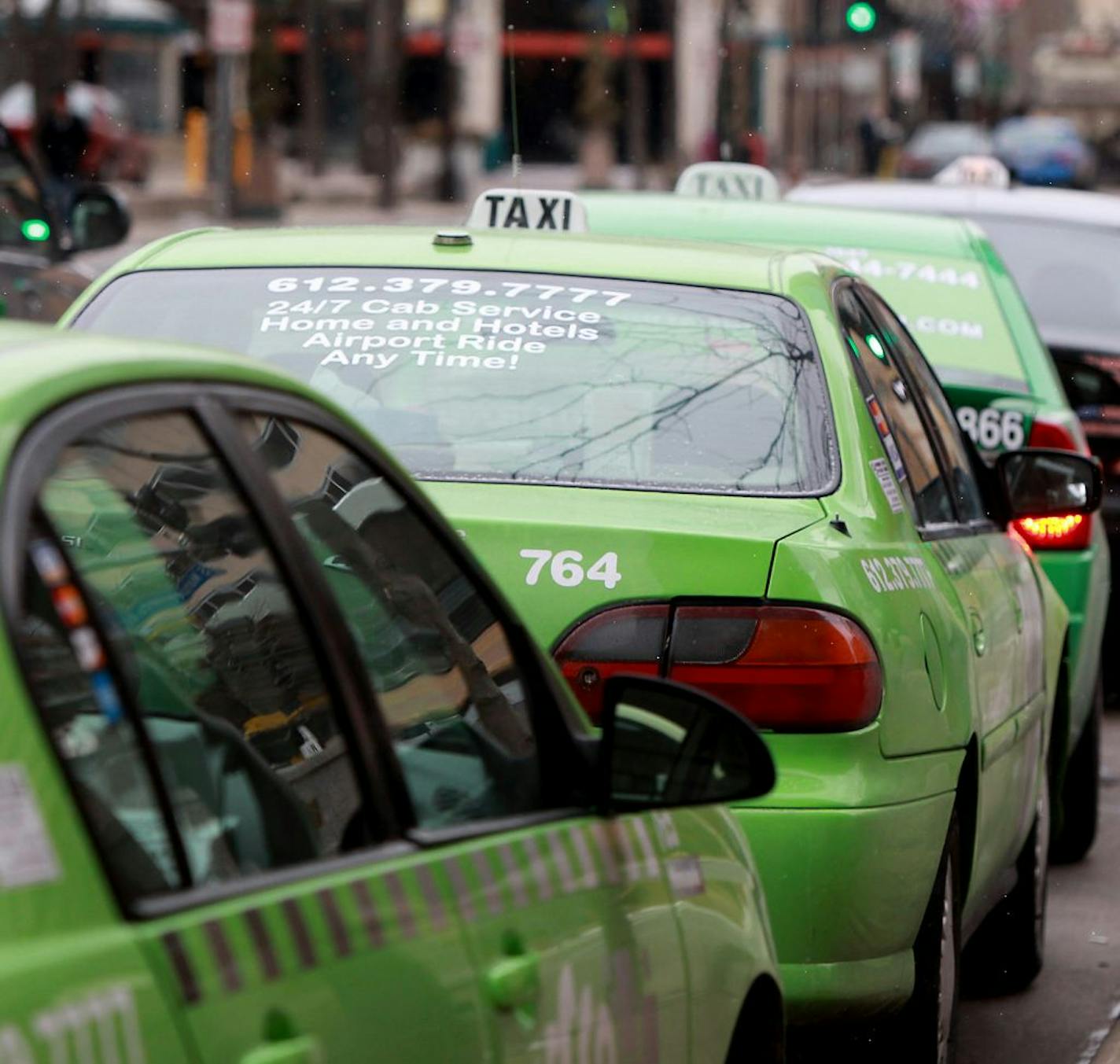 Most taxi dowtown taxi cabs had credit card logos posted on their vehicles in downtown Minneapolis, Friday, January 13, 2012. Minneapolis City Council passed an ordinance requiring taxi cabs to take credit cards, effective June 1. (ELIZABETH FLORES/STAR TRIBUNE) ELIZABETH FLORES � eflores@startribune.com