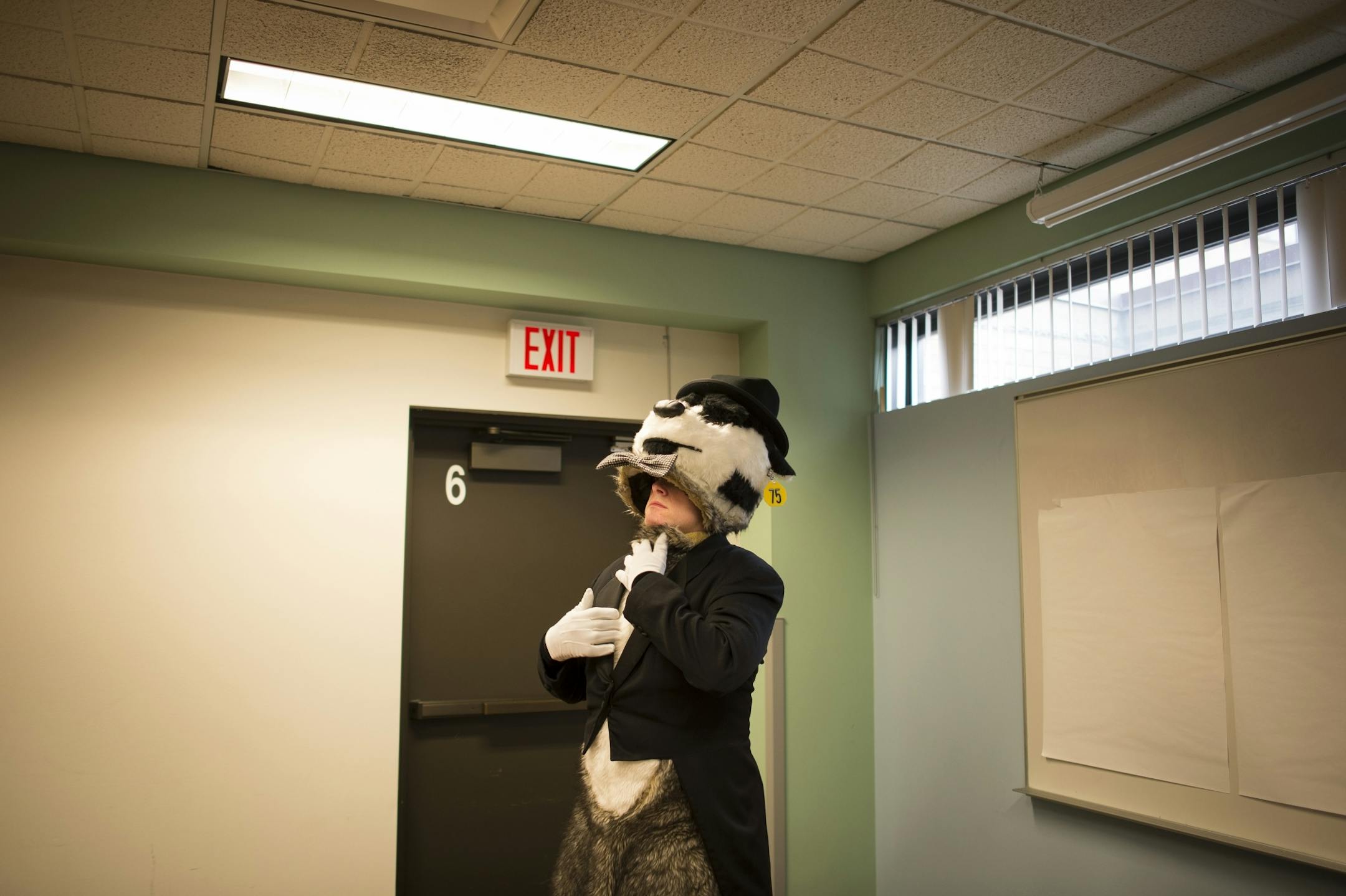 Kirk A. Badger prepared his fur suit before the Winter Carnival Parade in late January.