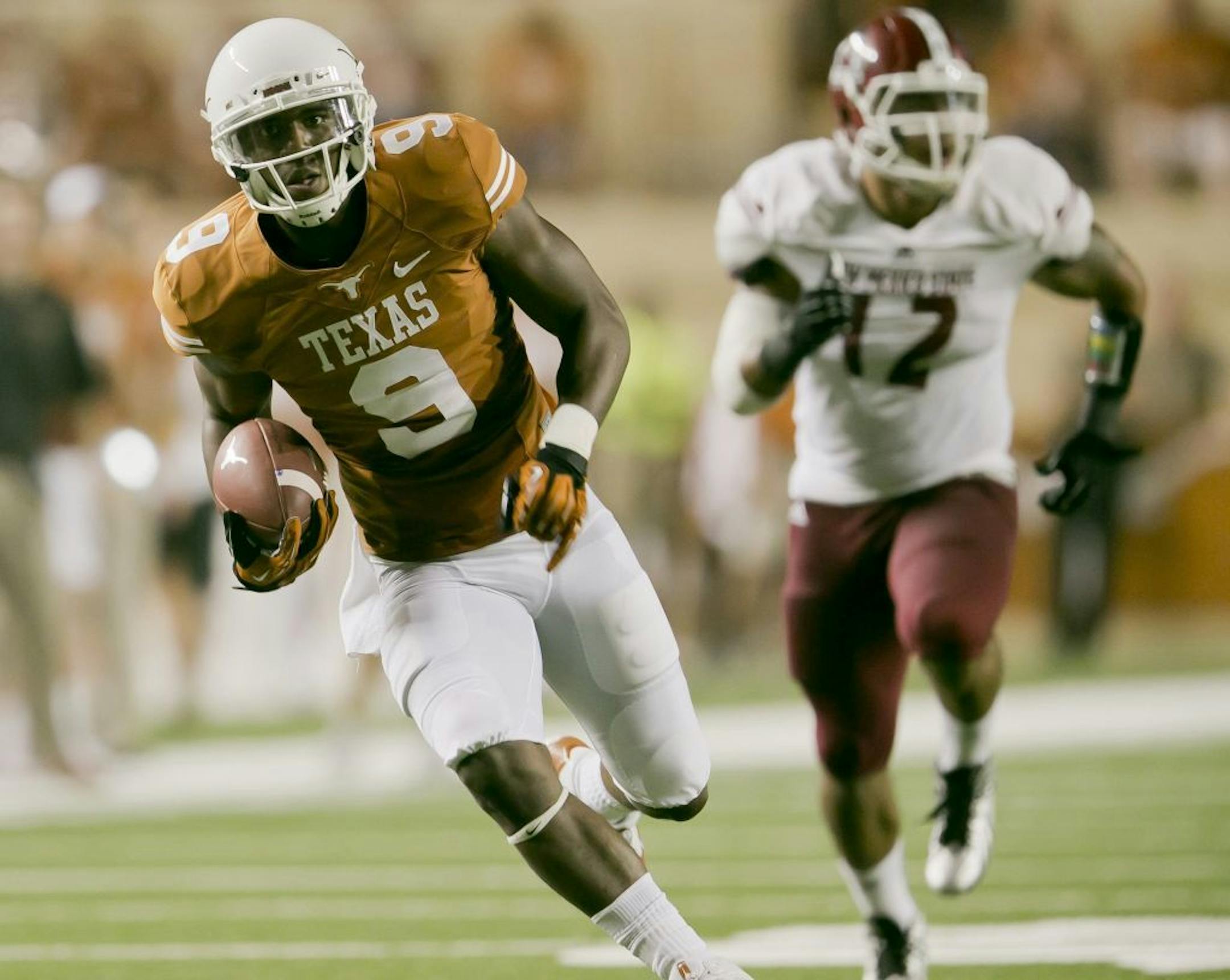 The University of Texas Longhorns' (9) John Harris runs into the end zone for a touchdown against New Mexico State in the first half at Darrell K Royal-Texas Memorial Stadium in Austin, Texas, Saturday, August 31, 2013.