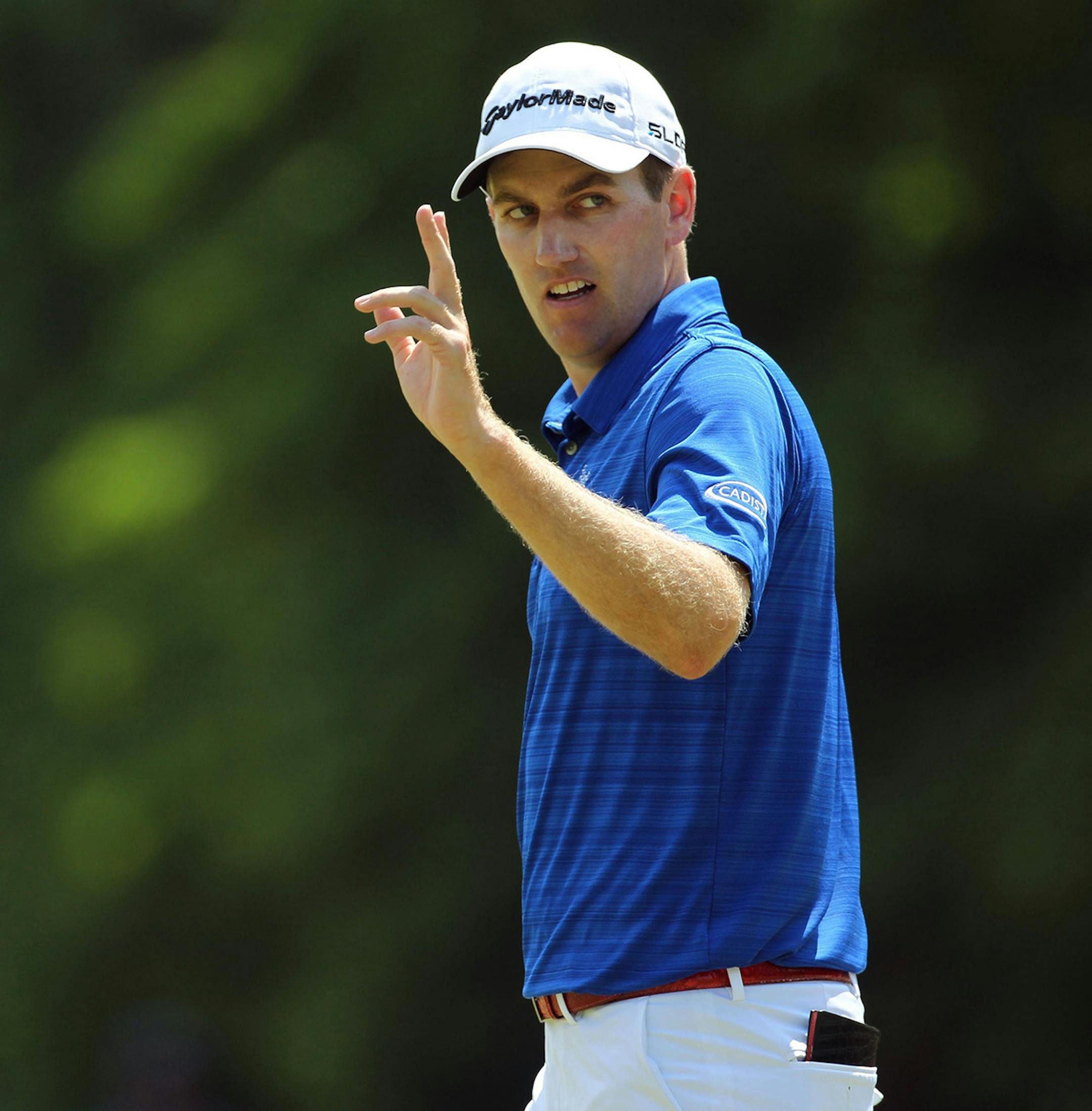 Golfer Brendon Todd acknowledges the crowd after making a par on the first hole during the third round of the 2014 U.S. Open at Pinehurst No. 2 in Pinehurst, N.C., Saturday, June 14, 2014.