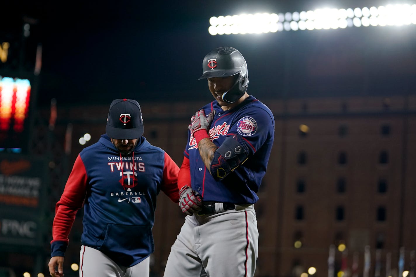 Twins bench coach Jayce Tingler stands next to Carlos Correa after he was hit by a pitch from Orioles starting pitcher Spenser Watkins during the fifth inning Thursday.