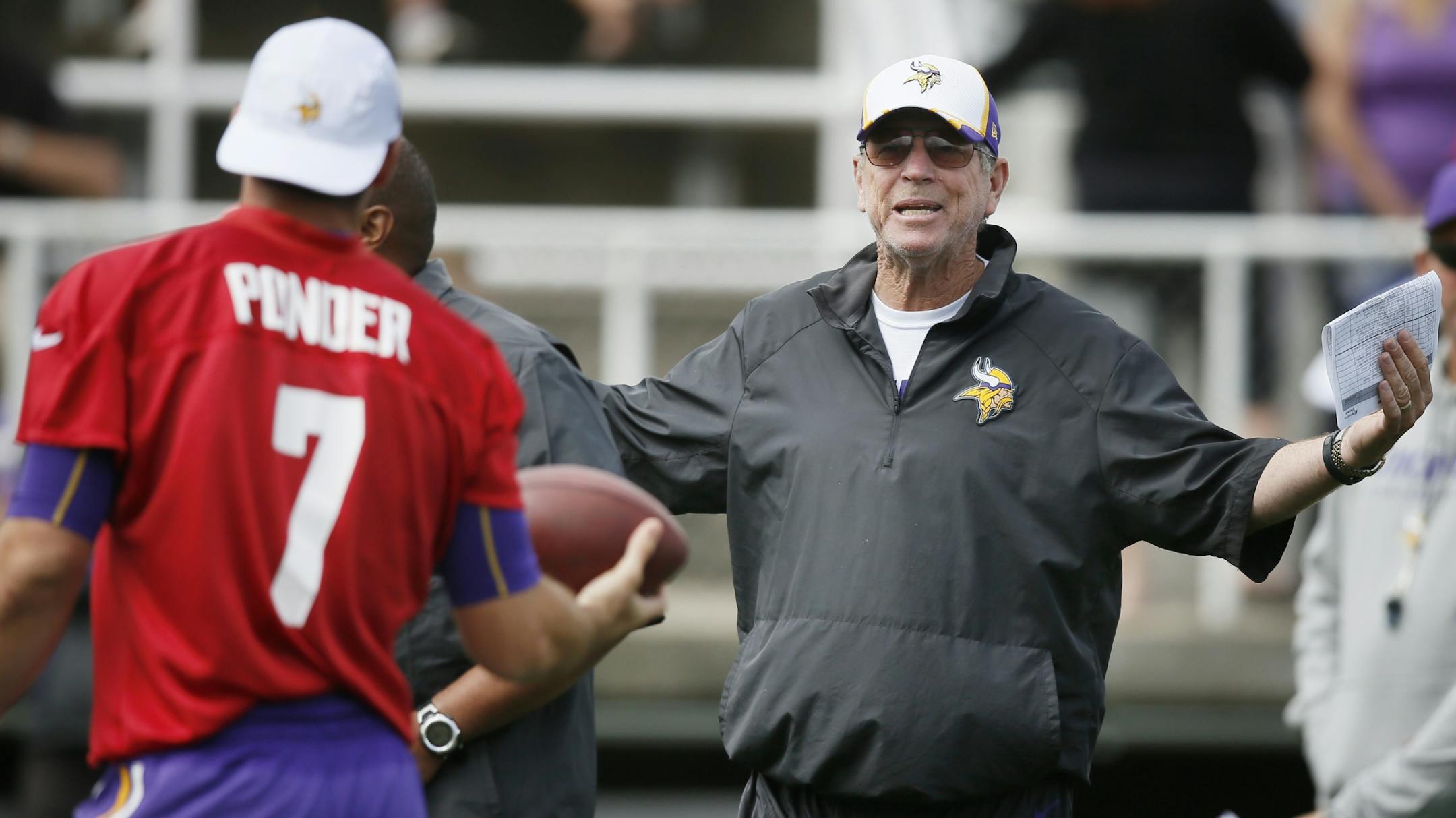 Offensive coordinator Norv Turner talked with quarterback Christian Ponder during NFL camp at Minnesota State ,Mankato Sunday July 27, 2014 in Mankato, MN .