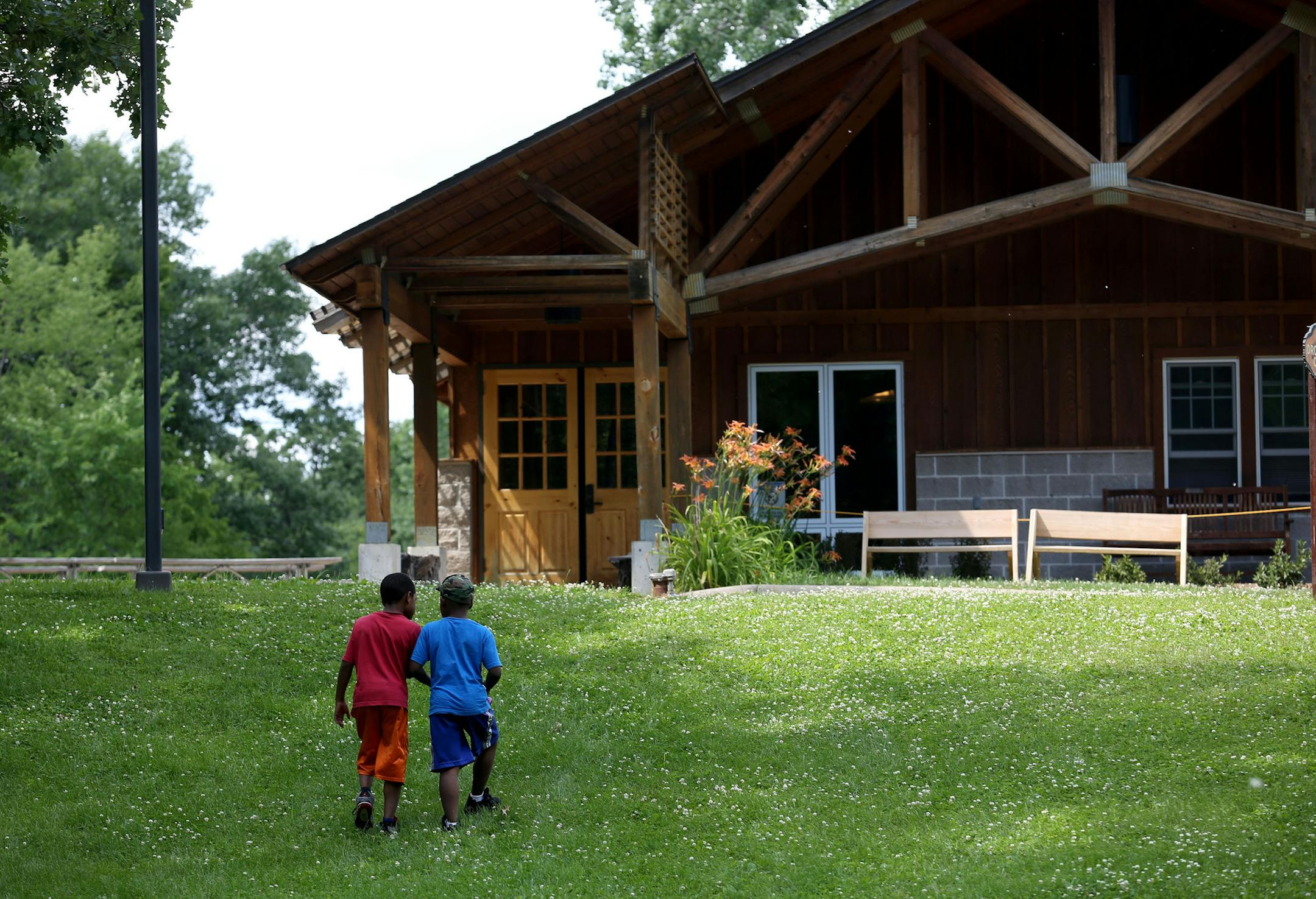 Campers walked back up to the lodge during their rotation ] (KYNDELL HARKNESS/STAR TRIBUNE) kyndell.harkness@startribune.com The Boys and Girls Club summer camp in Mound, aka Camp Voyageur in Mound, Min. Wednesday, July 17, 2014. ORG XMIT: MIN1407170002031731