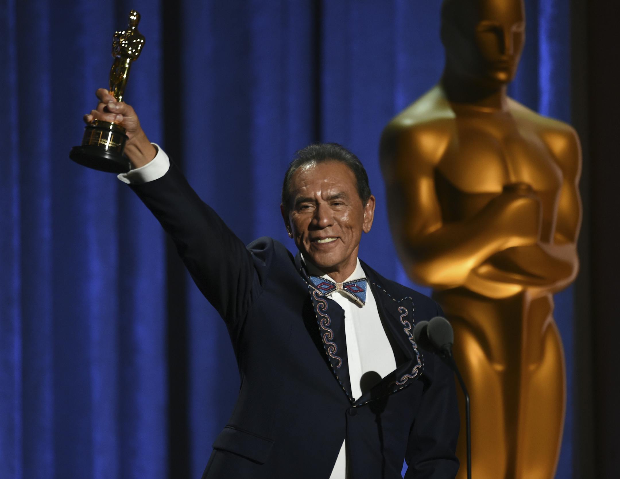 Wes Studi accepts an honorary award at the Governors Awards on Sunday, Oct. 27, 2019, at the Dolby Ballroom in Los Angeles. (Photo by Chris Pizzello/Invision/AP)