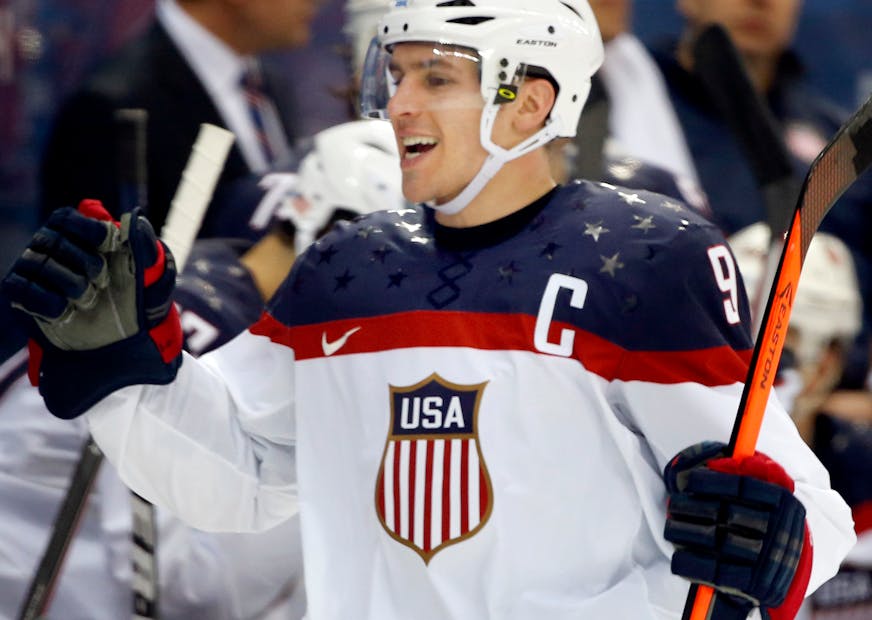 Zach Parise celebrated with teammates after he scored during the Sochi Games in 2014