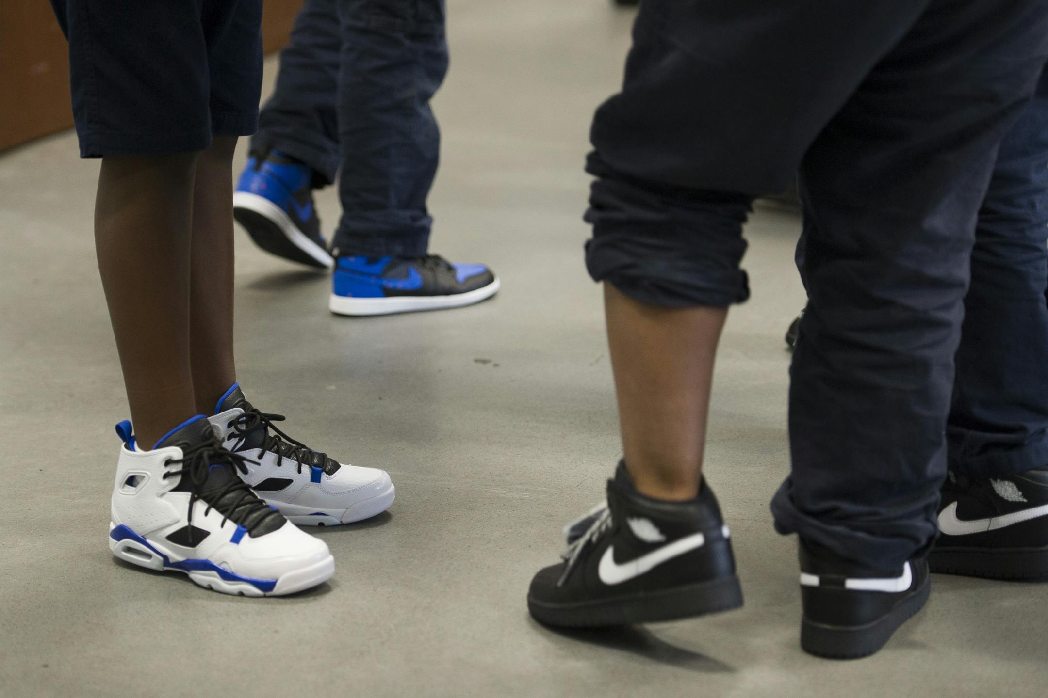 Students try out their new Nike Jordans shoes after they were placed on their feet by a member of the WNBA Champion Minnesota Lynx at Payne Elementary School in Washington, Wednesday, June 6, 2018. Payne Elementary has the highest homeless student population in the district.