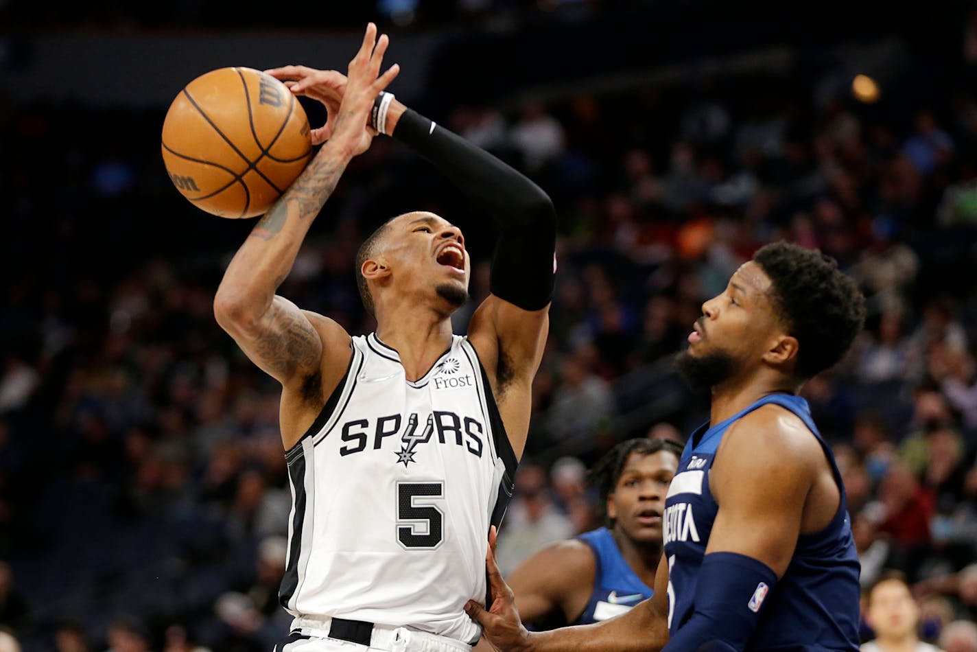 San Antonio guard Dejounte Murray had the ball knocked away by Timberwolves guard Malik Beasley in the second half